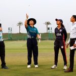 ABU DHABI, UNITED ARAB EMIRATES - MAY 01: Naruemol Chaiwai, Captain of Thailand, throws the coin at the toss as Sindhu Sriharsha, Captain of the USA, looks on prior to the ICC Women's T20 World Cup Qualifier 2024 match between Thailand and USA at Zayed Cricket Stadium on May 01, 2024 in Abu Dhabi, United Arab Emirates. (Photo by Francois Nel-ICC/ICC via Getty Images)